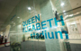 A glass printed 'Queen Elizabeth Stadium' in Distrubution Exchange Lobby